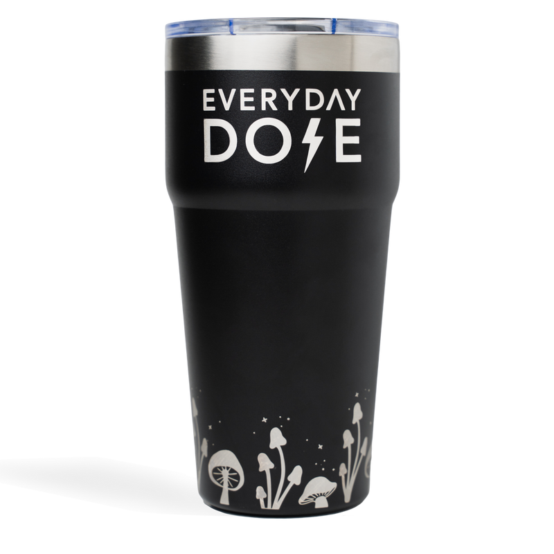 Black tumbler with Everyday Dose text and decorative mushroom silhouettes at base, stainless steel rim